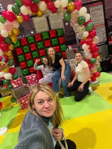 Founders and a volunteer preparing and decorating the venue for tomorrow’s event.
