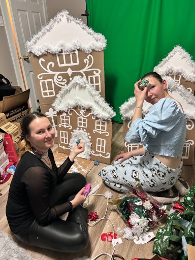 Founder and creative lead Korneliia Khryplyvets creating decorations for the family celebration alongside volunteer Tetyana Rymska.